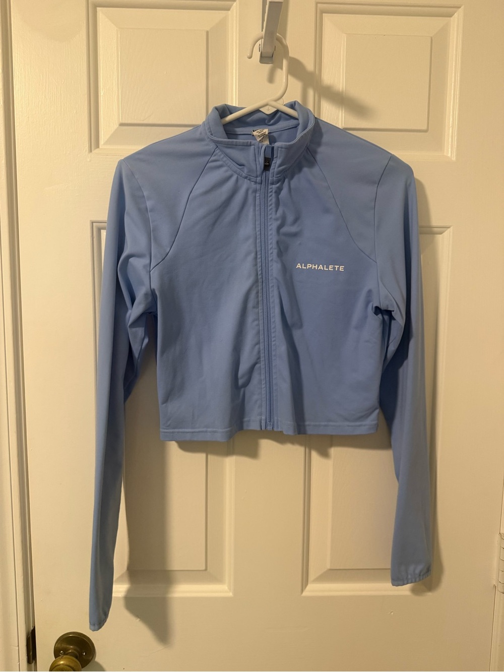 Alphalete Cropped Zip-Up Jacket in Light Blue